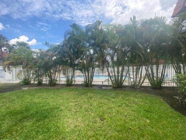 property at 10055 NW 4th St