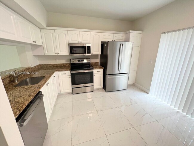 9820 NW 56th Pl in Coral Springs, FL - Building Photo - Building Photo