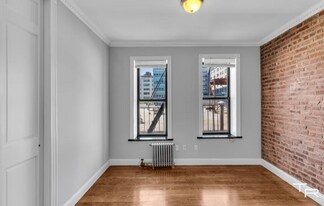 E. 100th St, 2nd Ave in New York, NY - Building Photo