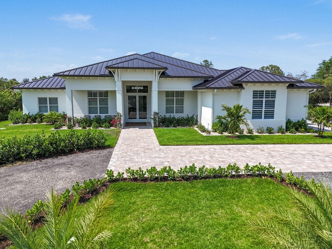 9105 Whippoorwill Trail in Jupiter, FL - Building Photo - Building Photo