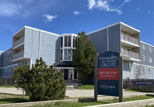 The Courtyards Apartments in Grande Prairie, AB - Building Photo - Building Photo
