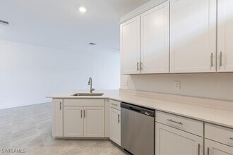 19601 Hinkley Dr in Estero, FL - Building Photo - Building Photo