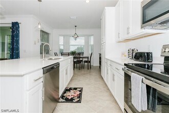 6034 National Blvd, Unit 542 in Ave Maria, FL - Foto de edificio - Building Photo