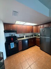 2069 NE Collins Cir, Unit 7-10 in Jensen Beach, FL - Building Photo - Building Photo
