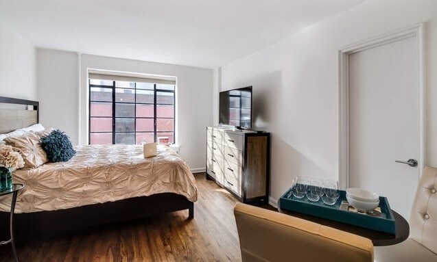 61 W 8th St in New York, NY - Building Photo