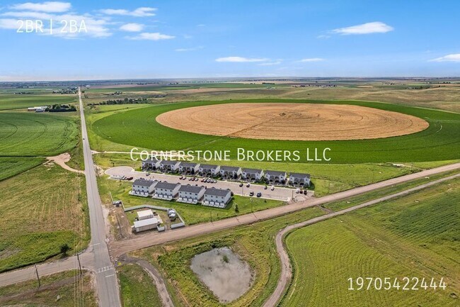 100 Parkview Ct-Unit -C in Wiggins, CO - Building Photo - Building Photo