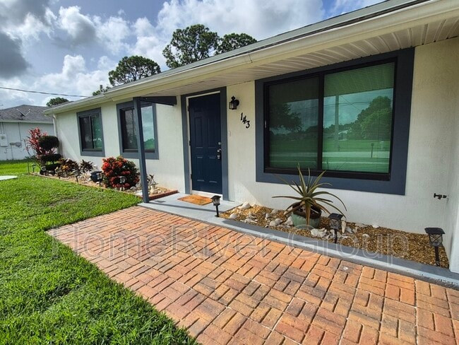 property at 143 SW Tulip Blvd