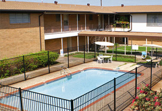 Tropicana Apartments in Groves, TX - Building Photo - Building Photo