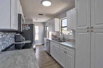 6052 Lace Wood Cir in Atlantis, FL - Building Photo - Building Photo