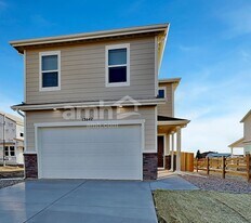 13842 E 100th Dr in Commerce City, CO - Building Photo