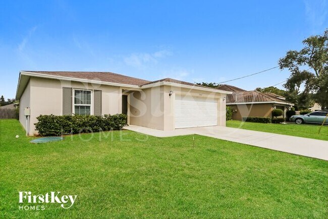 1989 SW MacKenzie St in Port St. Lucie, FL - Building Photo - Building Photo