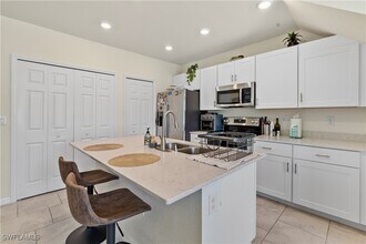 14026 Oviedo Pl in Tice, FL - Building Photo - Building Photo