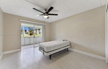 100 Village Green Cir E in Palm Springs, FL - Building Photo - Building Photo