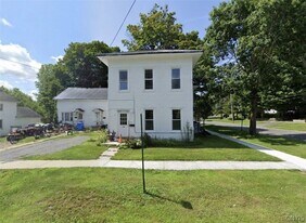 8 S Main St in West Carthage, NY - Building Photo