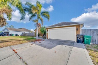 214 SW Milburn Cir in Port St. Lucie, FL - Building Photo - Building Photo