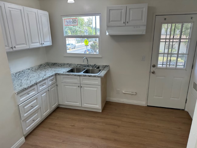 property at 7329 Normandie Ave