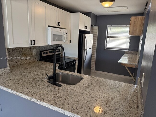 property at 842 NE 209th St