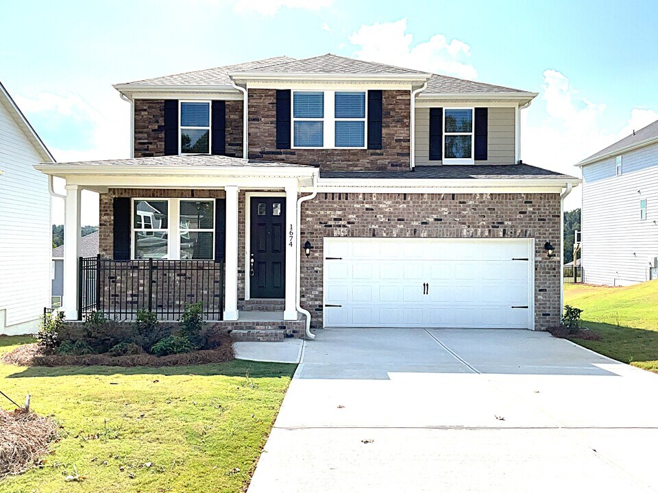 1674 Soapstone Rd in Dacula, GA - Building Photo