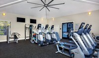 Brand new fitness center with cardio equipment, weight machines, and spin room - Saybrook Pointe Apartment Homes in San Jose, California