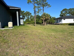 1221 Ecstasy St E in Lehigh Acres, FL - Building Photo - Building Photo