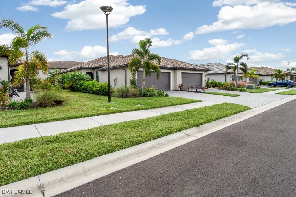 14059 Winding Cedar Wy in Miromar Lakes, FL - Building Photo