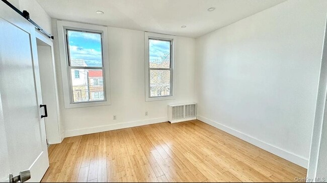 property at 68-52 76th St