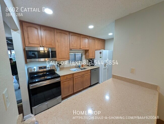 property at 8602 Cattail Dr