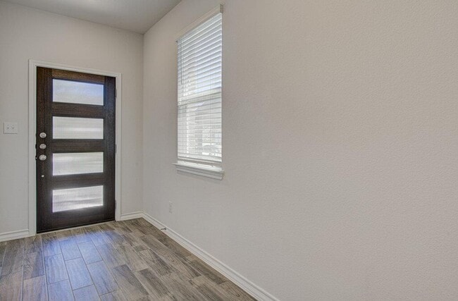 196 Pepperbark Loop in Mustang Ridge, TX - Building Photo - Building Photo