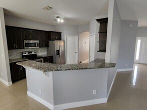 2466 SW Mercer St in Port St. Lucie, FL - Building Photo - Building Photo