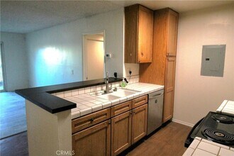 23515 Lyons Ave, Unit 201 in Santa Clarita, CA - Building Photo - Building Photo