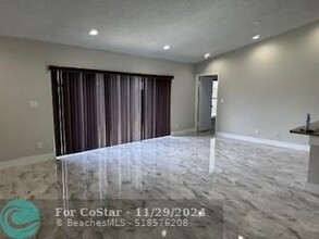 5909 Woodland Point Pl in Tamarac, FL - Building Photo - Building Photo