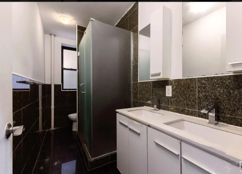 W. 124th St, St Nicholas Ave in New York, NY - Building Photo