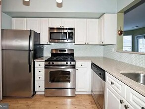 12913 Alton Sq, Unit 406 in Herndon, VA - Building Photo - Building Photo