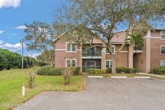 7667 N Wickham Rd, Unit 1201 in Melbourne, FL - Foto de edificio - Building Photo