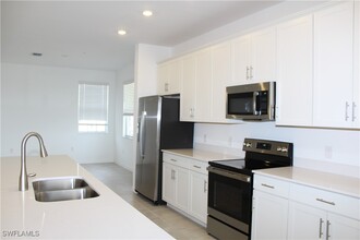 5686 Melbourne Ct in Ave Maria, FL - Foto de edificio - Building Photo