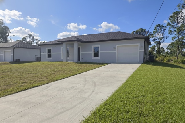 322 Mangonia Ave in Lehigh Acres, FL - Building Photo - Building Photo