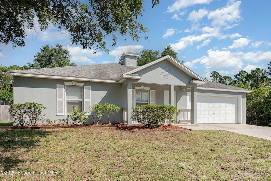 1066 Quesada St SE in Palm Bay, FL - Foto de edificio