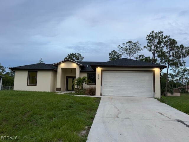 208 Grant Ave in Lehigh Acres, FL - Building Photo - Building Photo