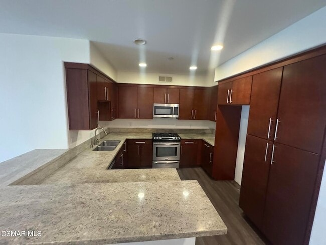 14412 Killion St, Unit 102 in Los Angeles, CA - Building Photo - Building Photo