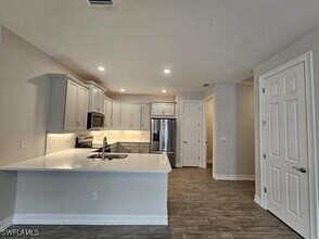 1011 Enbrook Lp in Naples, FL - Building Photo - Building Photo