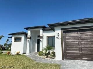 3127 NW 42nd Pl in Cape Coral, FL - Building Photo