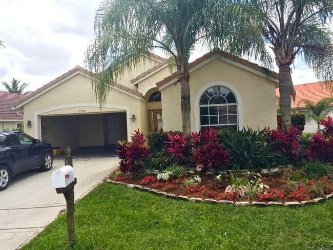 1592 Carriage Brooke Dr in Wellington, FL - Building Photo - Building Photo