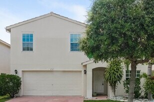 6587 Rainwood Cove Ln in Lake Worth, FL - Building Photo