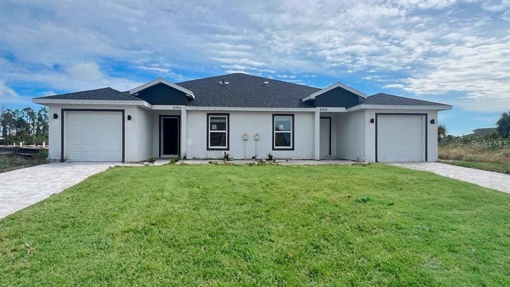 8456 Dinnano St in Port Charlotte, FL - Building Photo