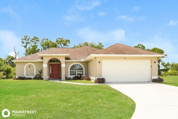 504 Redwood Ave S in Lehigh Acres, FL - Foto de edificio