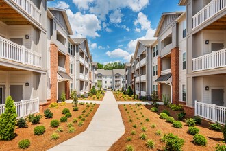 Evoke Living at Sugar Creek Apartments in Charlotte, NC - Building Photo - Building Photo