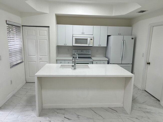 property at 4950 White Mangrove Way E