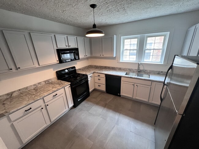 7248 Amherst Ave in University City, MO - Foto de edificio - Building Photo