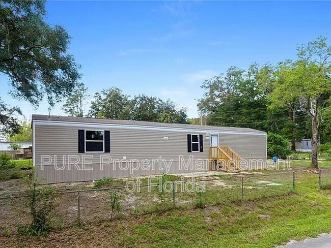 16364 SE 57th St in Ocklawaha, FL - Foto de edificio - Building Photo