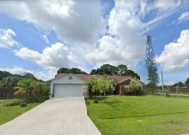 property at 1198 SW Ingrassina Ave